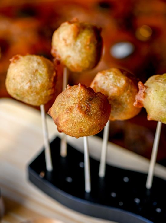 Golden dosa pops served on skewers